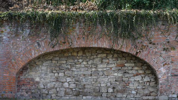 Brick arch and stone wall texture