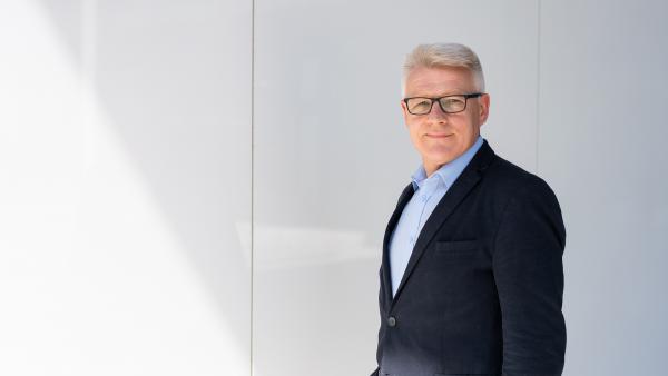 Businessman on white wall photo