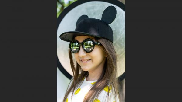 Girl in funny hat photo