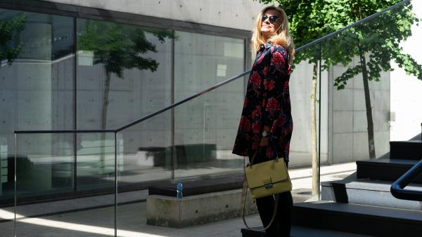 Female standing in the sun rays