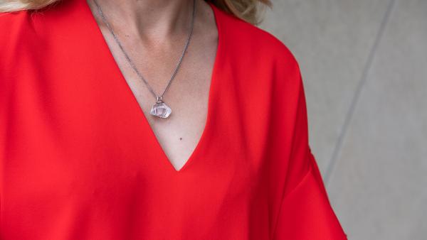 Neckless next to red dress