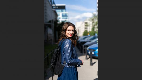 Beautiful girl walking down the street