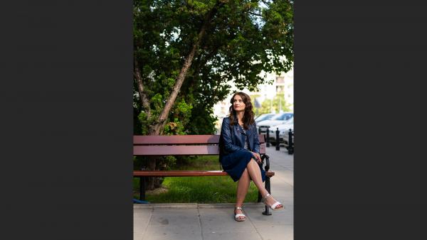 Girl sitting on bench photo