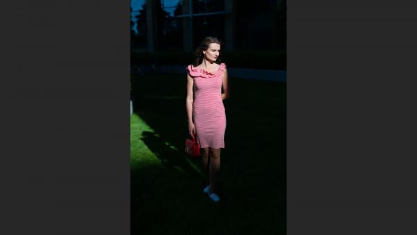 Beautiful girl in sun rays