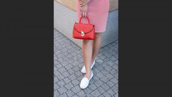 Girl's legs and handbag