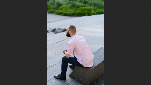 Young corporate worker sitting