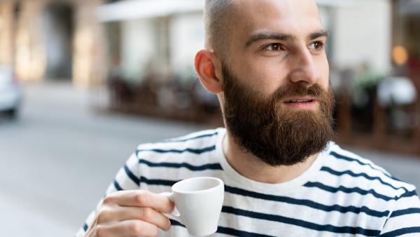 Smart guy drinking coffee