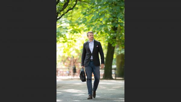 Walking businessman with briefcase