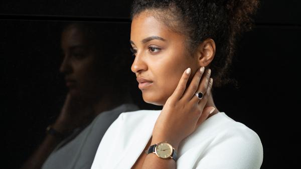 Black woman in hand on face