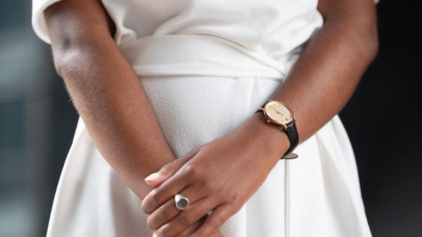 Close up to watch and ring on female hands