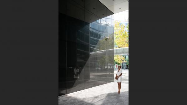 Woman between walls from a distant perspective