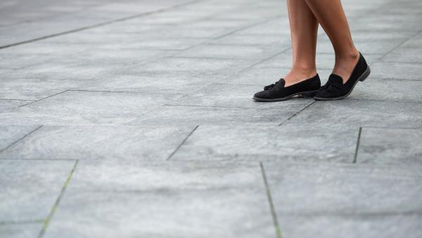 Woman legs on flat shoes