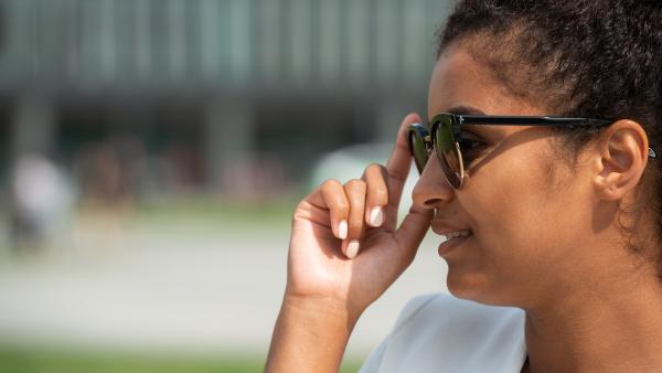 Black woman in profile on sunglasses
