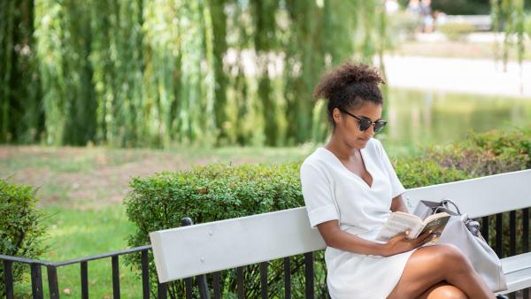 Sitting woman reading a book