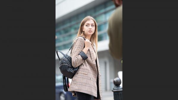 Young woman in backpack 