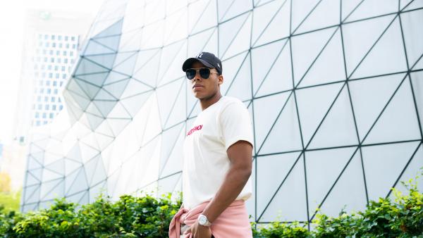 Black man near futuristic building