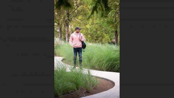 Young man standing in park