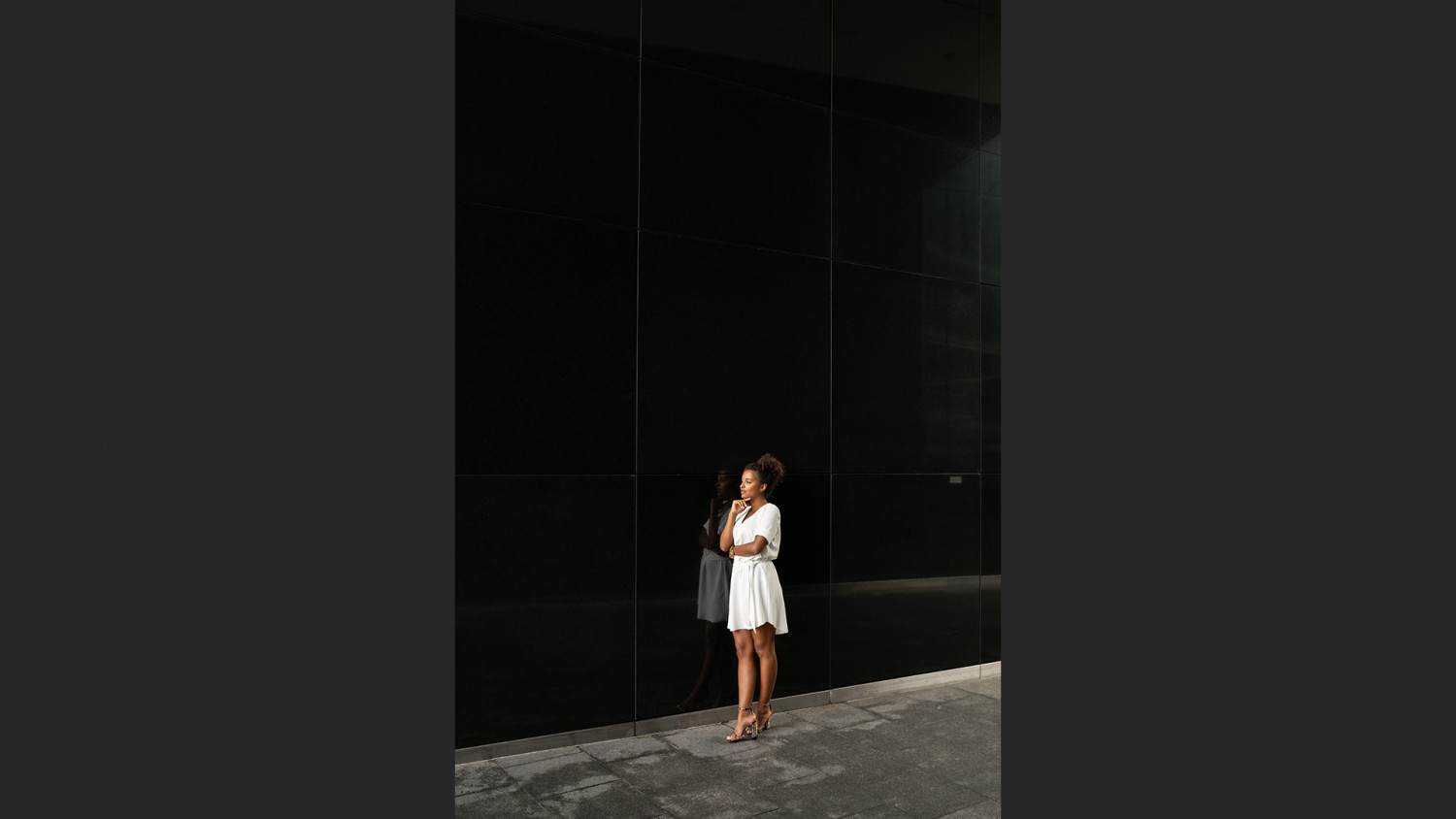 Young woman standing see from far away perspective image
