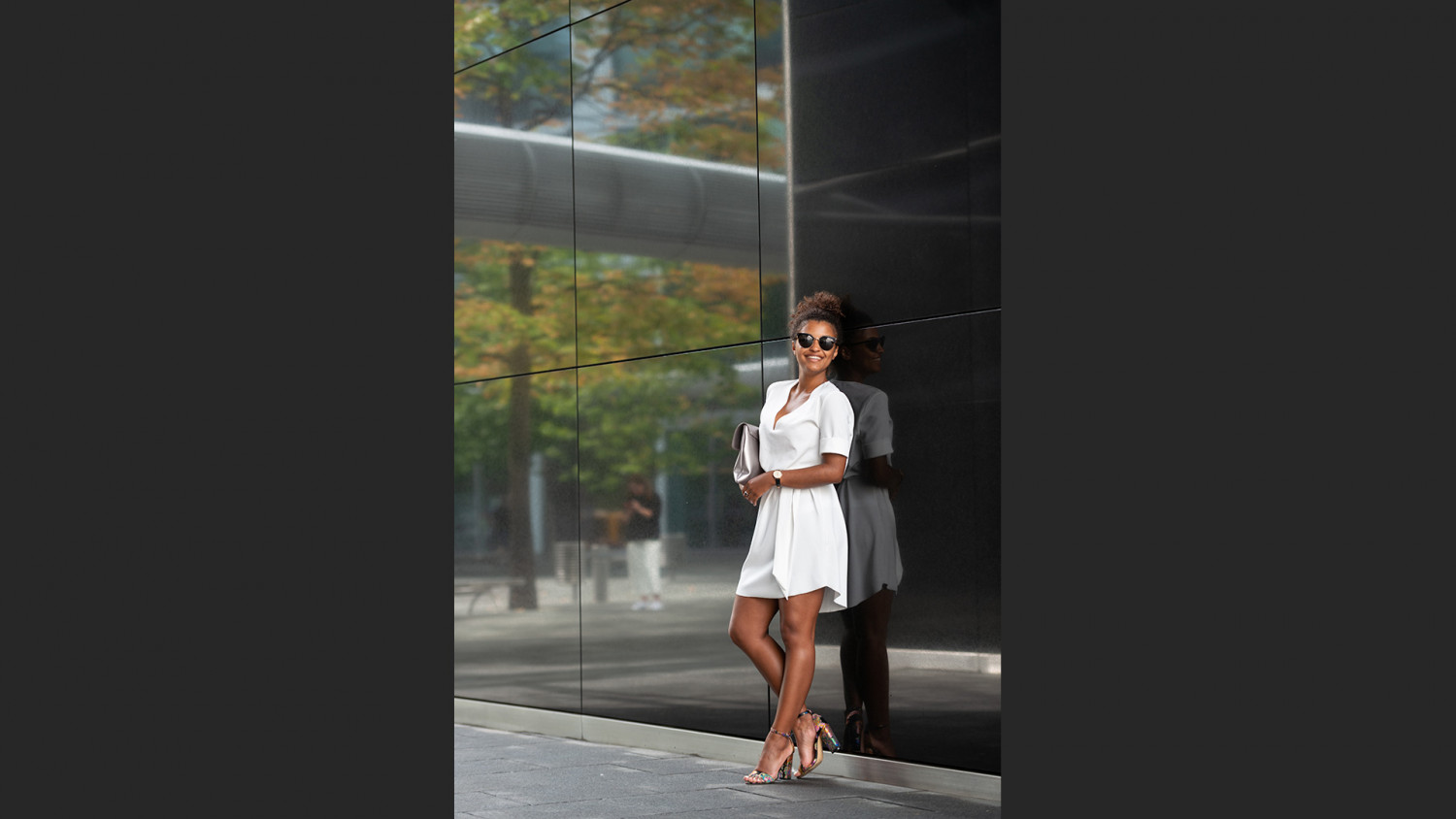 Corporate working woman next to glass wall image